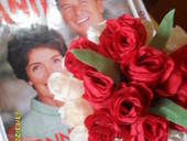 A Bouquet Of Paper Spray Roses In A Jar