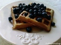 Oatmeal Banana Waffles Topped With Blueberries In Syrup