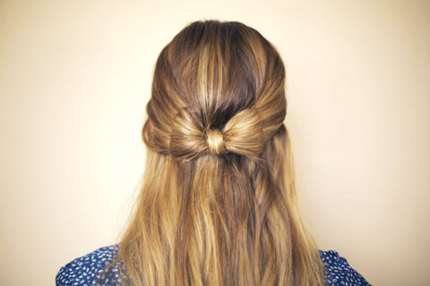 How to do a half-up bow with your hair.   .  Free tutorial with pictures on how to style a bow bun in under 15 minutes by hairstyling with hair. How To posted by Stephanie B. Difficulty: Easy. Cost: Absolutley free. Steps: 5