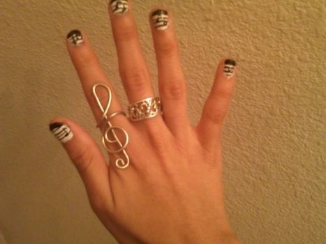 A Treble Clef Ring For All You Music Lovers <3 .  Free tutorial with pictures on how to make a trebel clef wire ring in under 15 minutes by jewelrymaking and wireworking with pliers, wire cutter, and wire cutter. Inspired by music & bands, kawaii, and clothes & accessories. How To posted by martinaguitron11. Difficulty: Easy. Cost: Absolutley free. Steps: 9