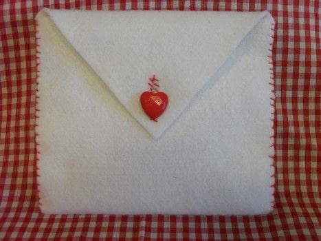 Never to young for handcrafted gifts .  Free tutorial with pictures on how to make an envelope in under 60 minutes by sewing with fabric, felt, and buttons. Inspired by snowman. How To posted by Caz.  in the Sewing section Difficulty: Simple. Cost: 3/5. Steps: 7