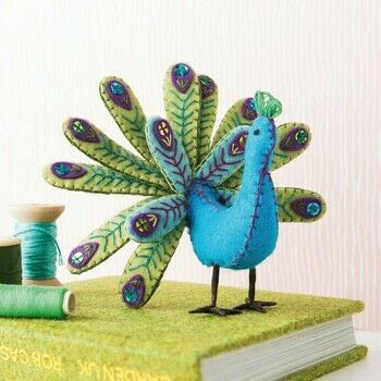 Folk Embroidered Felt Birds .  Free tutorial with pictures on how to make a peacock plushie in under 120 minutes by hand sewing with felt, felt, and felt. Inspired by peacock. How To posted by Search Press.  in the Needlework section Difficulty: Simple. Cost: Cheap. Steps: 12