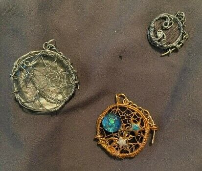 Tricky and time consuming, but worth it! .  Make a locket in under 150 minutes by constructing, jewelrymaking, and wireworking with wire and wire tools, dowel, and bottle caps. Inspired by stars and moon. Creation posted by Kin Dragon.  in the Jewelry section Difficulty: 4/5. Cost: No cost.