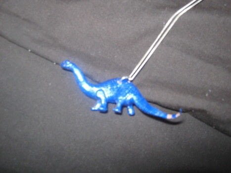 RawR! I <3 dinos .  Mold a clay pendant in under 60 minutes by jewelrymaking with jump rings, chain, and nail polish. Inspired by dinosaurs. Creation posted by Melvin. Difficulty: Easy. Cost: Absolutley free.