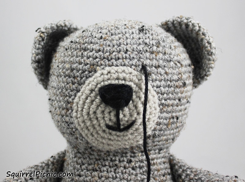 teddy bear with embroidered eyes
